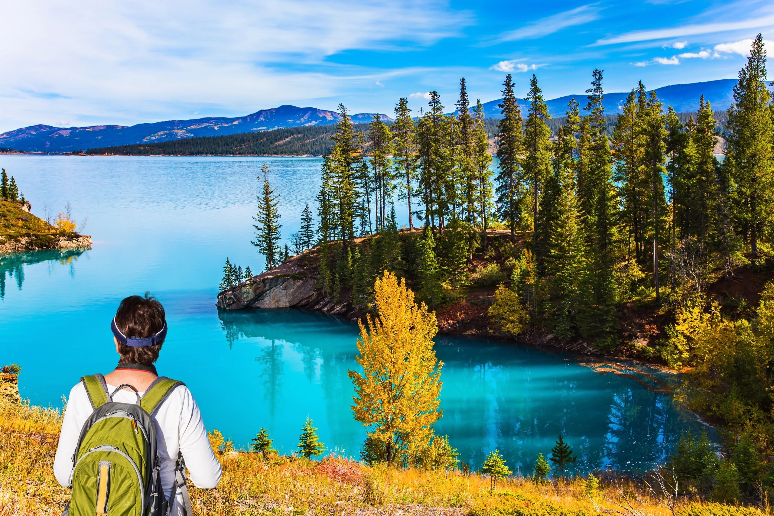 Hiker overlooking alpine lake – Healthy Compass Road Map