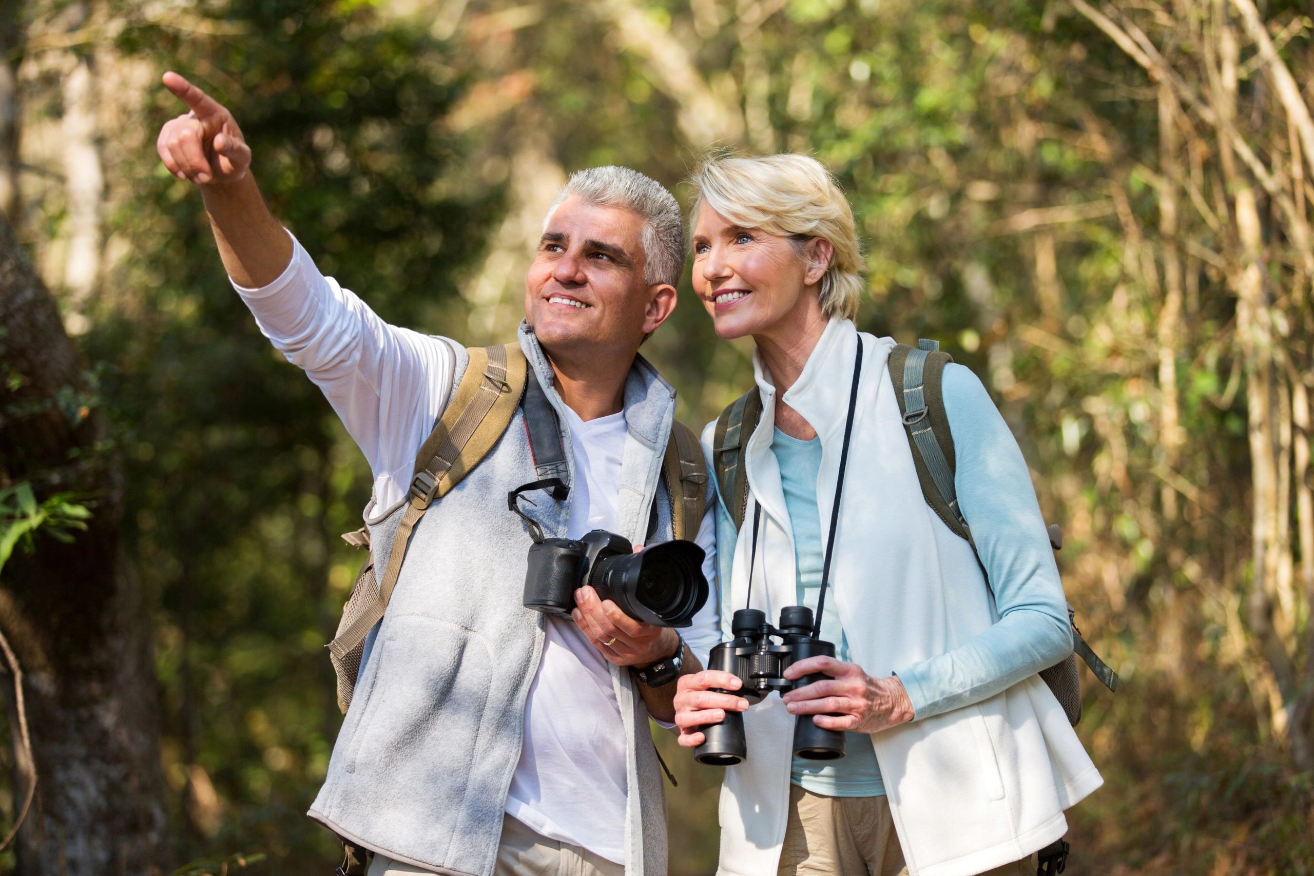 Mature adults hiking and birdwatching – Life Care Planning Road Map